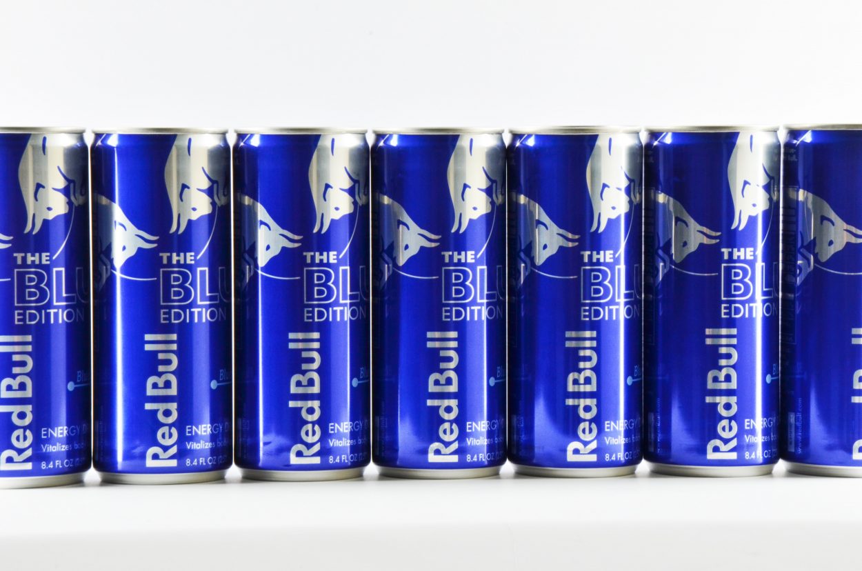 Red Bull blue edition cans lined up.