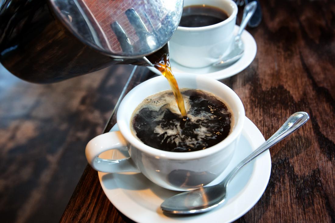 coffee being poured into a cup