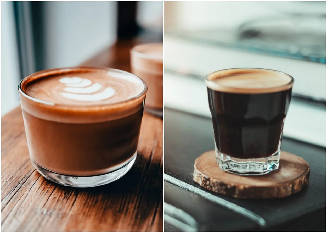Shot glasses containing a flat white and an espresso put side by side.