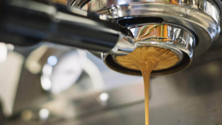 Crema pouring from machine.