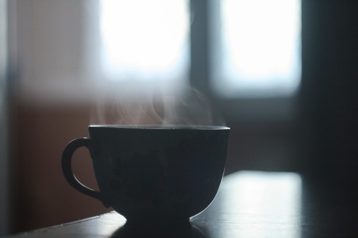 a steaming hot cup of coffee