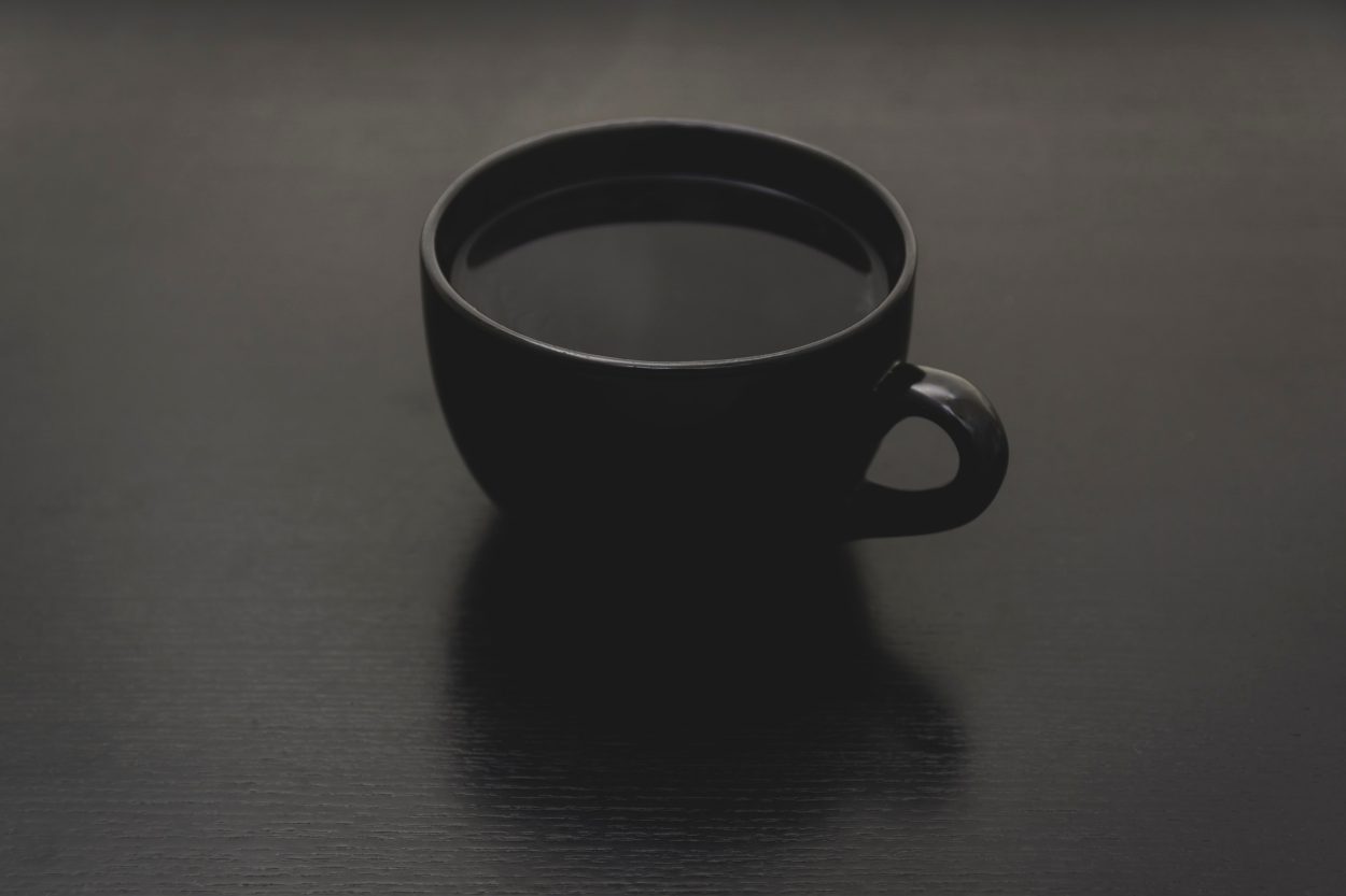 black coffee in a black cup