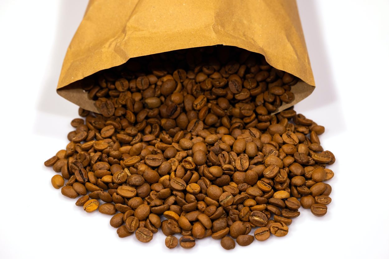 a bag spilling coffee beans