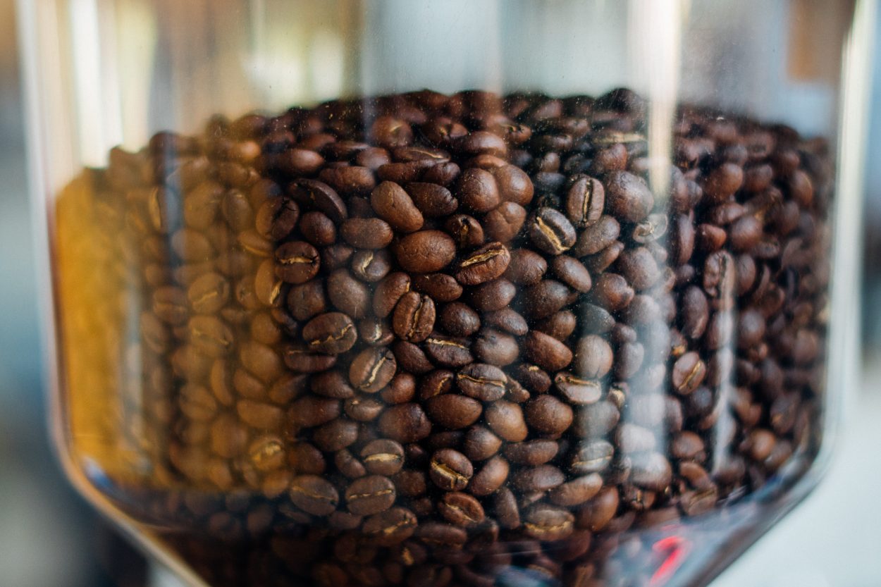 a grinder full of coffee beans