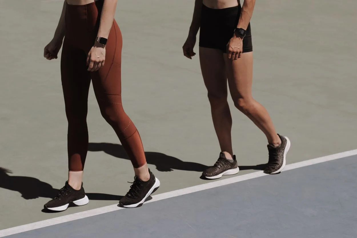 a pair of legs on a running track
