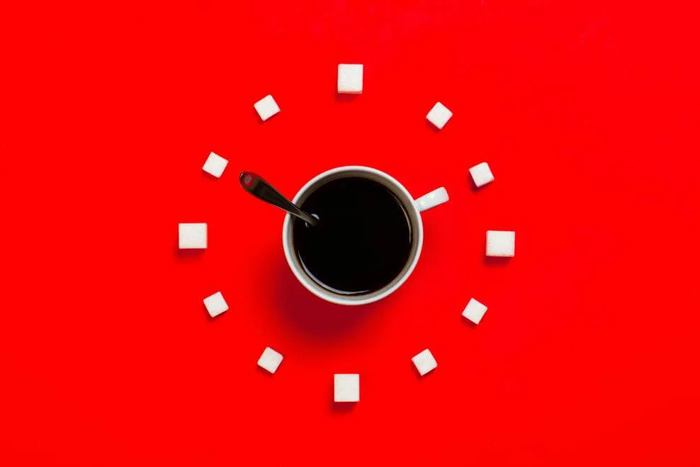 Black coffee with red background.