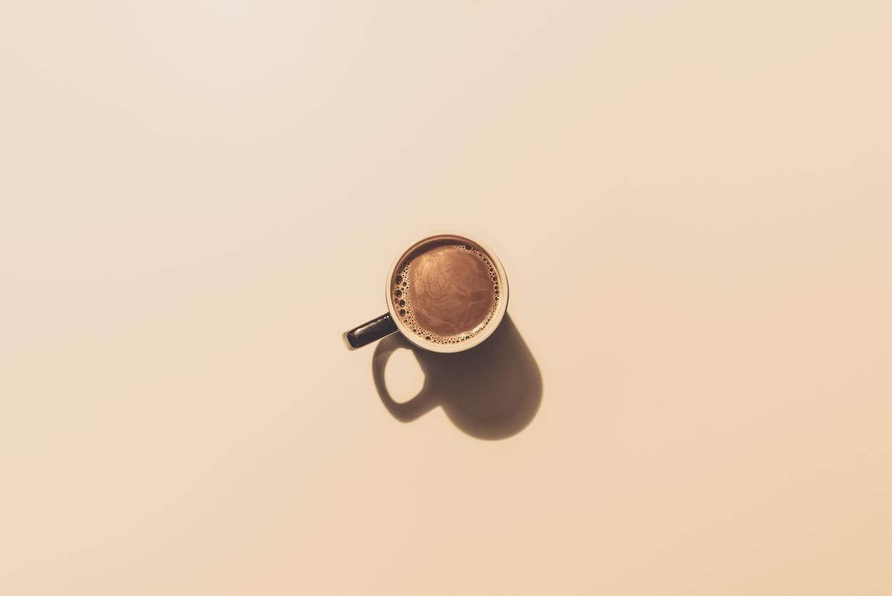 Coffee over a white table.