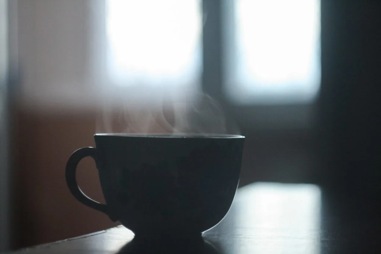 A steaming hot mug of coffee.