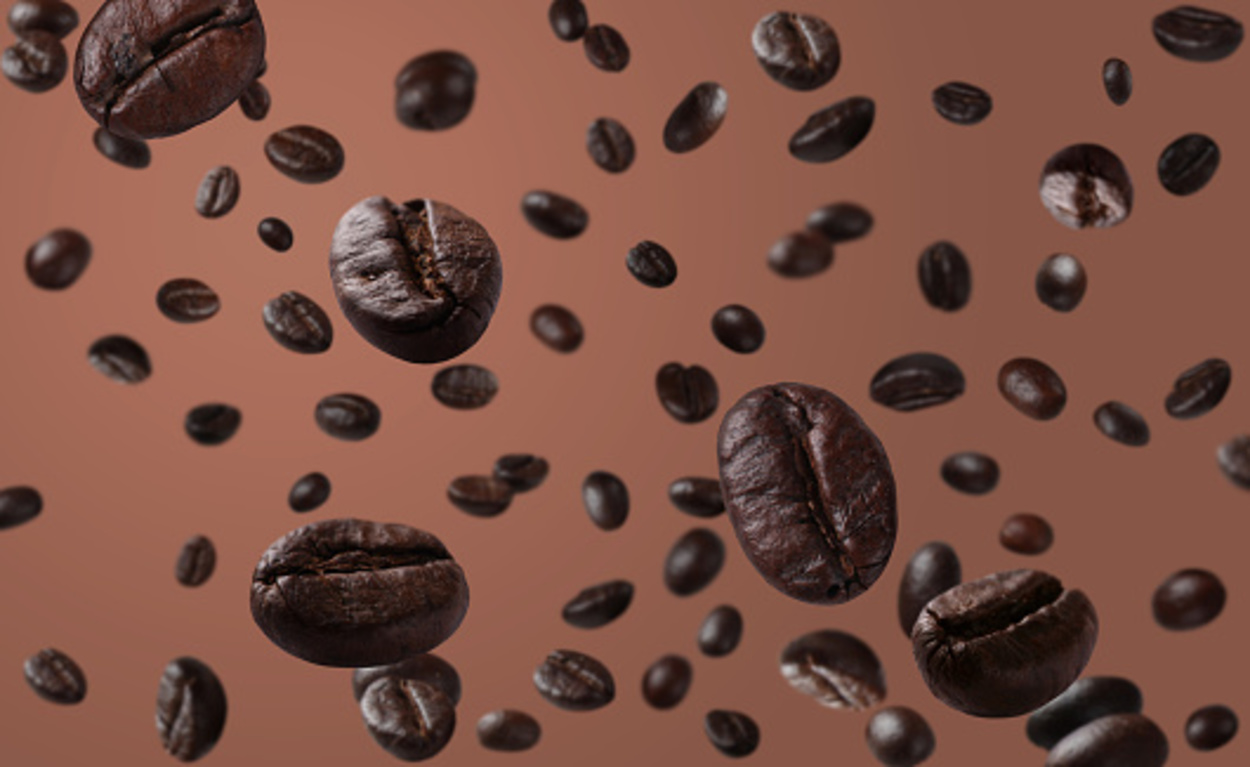 Roasted coffee beans falling down