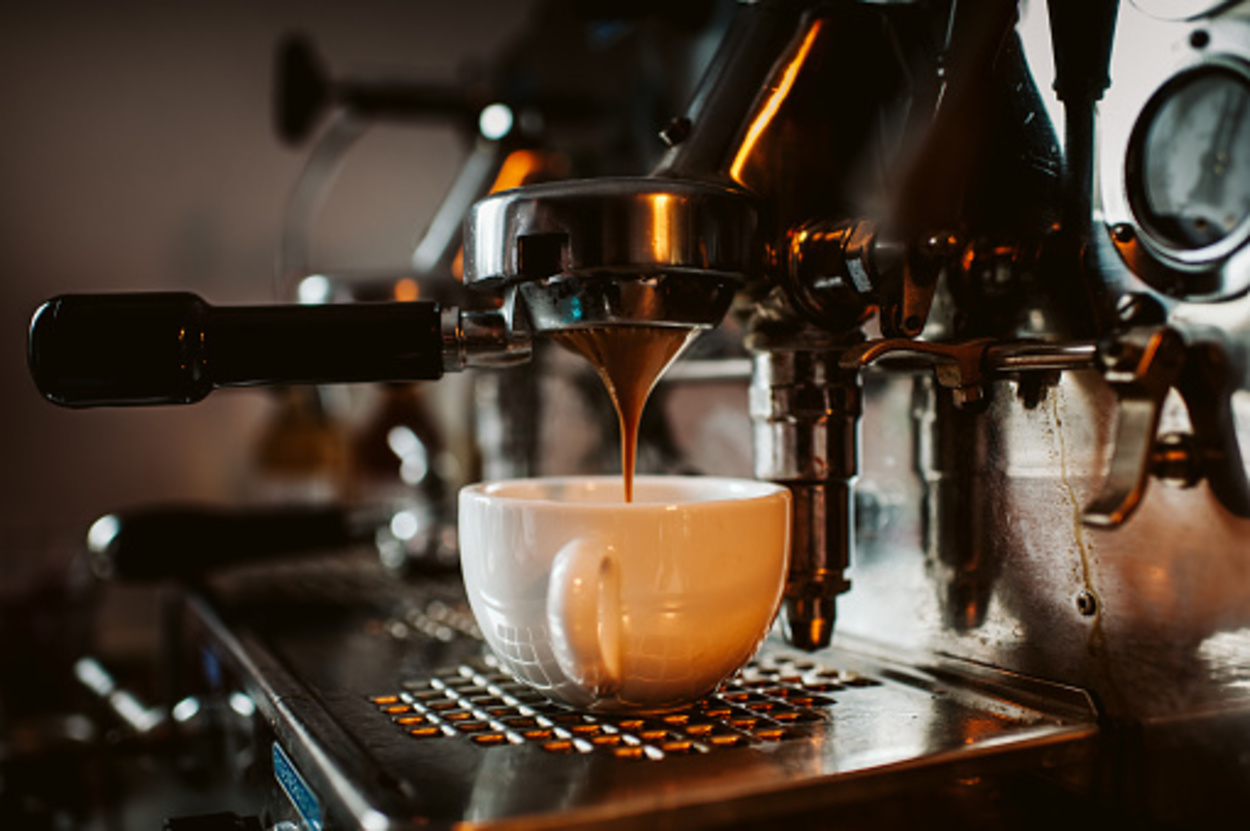 Espresso machine pouring coffee in cup