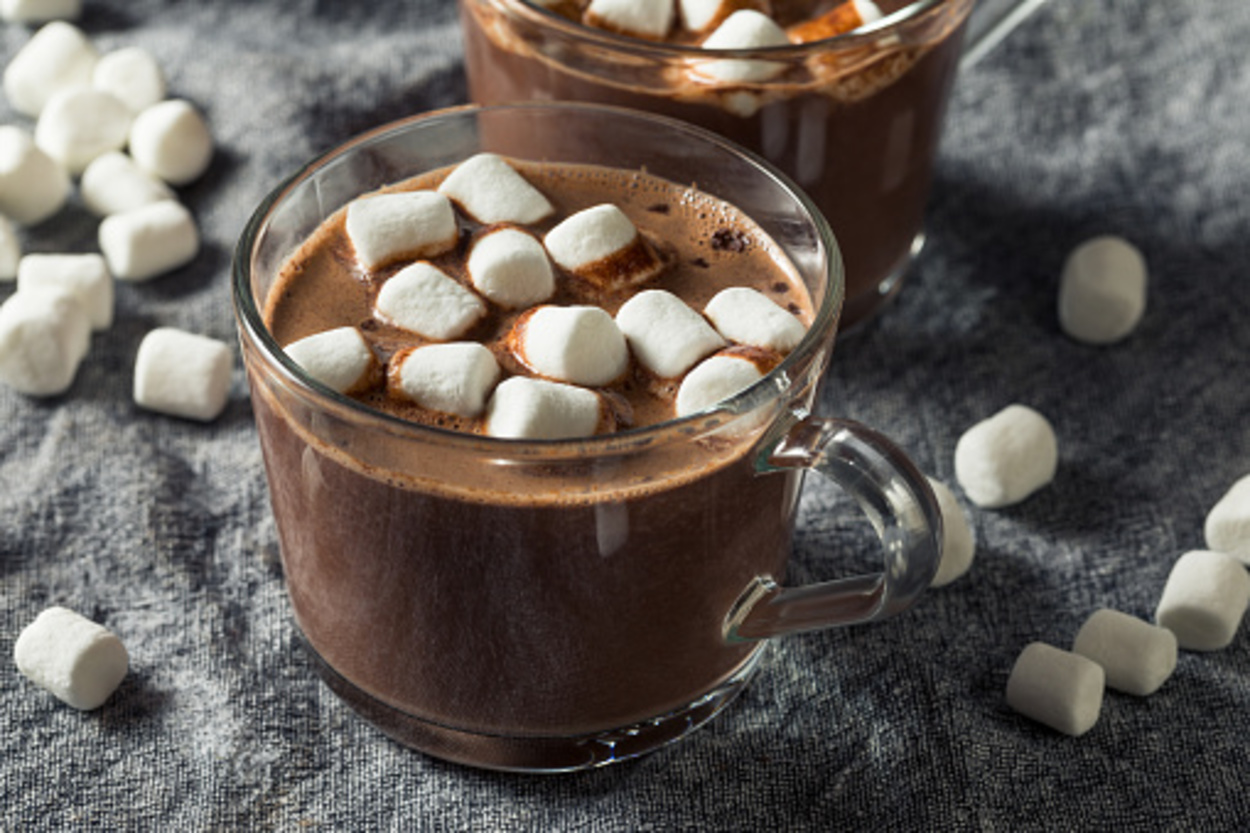A cup of hot chocolate with mini marshmallows on top