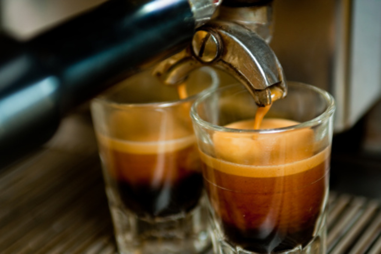 Two shots of espresso being poured