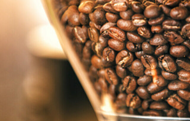 Close up coffee beans in grinder