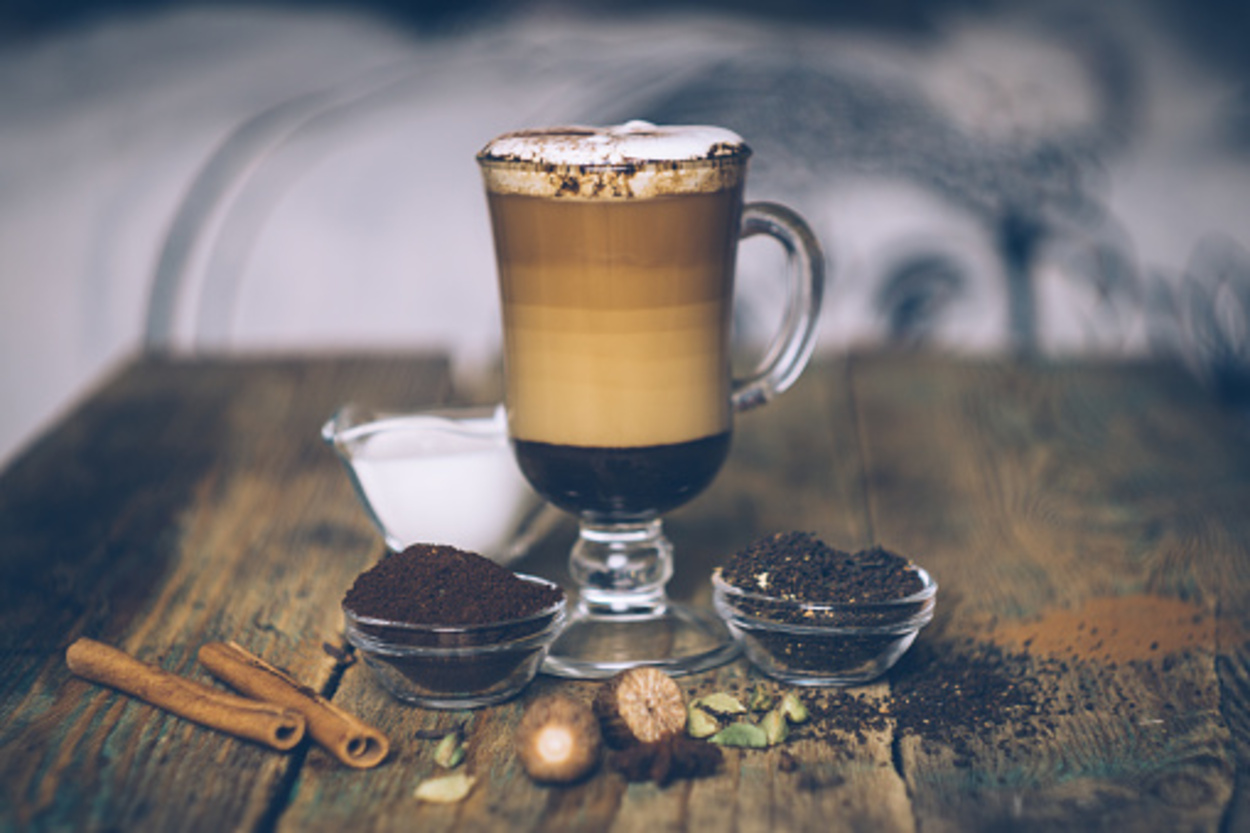 SPICE DIRTY CHAI LATTE. Masala chai and espresso. Autumn or winter warm spice coffee drink. Close up