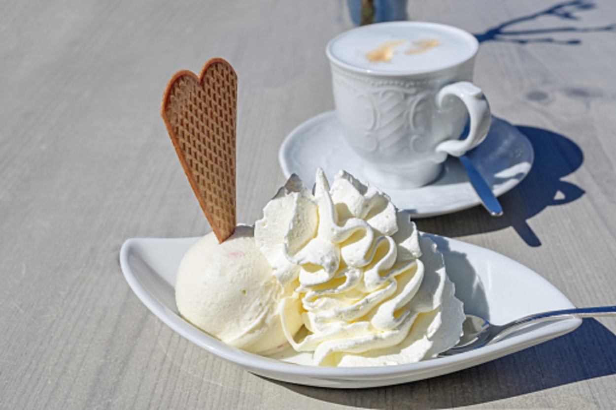 vanilla ice cream beside a cup of coffee