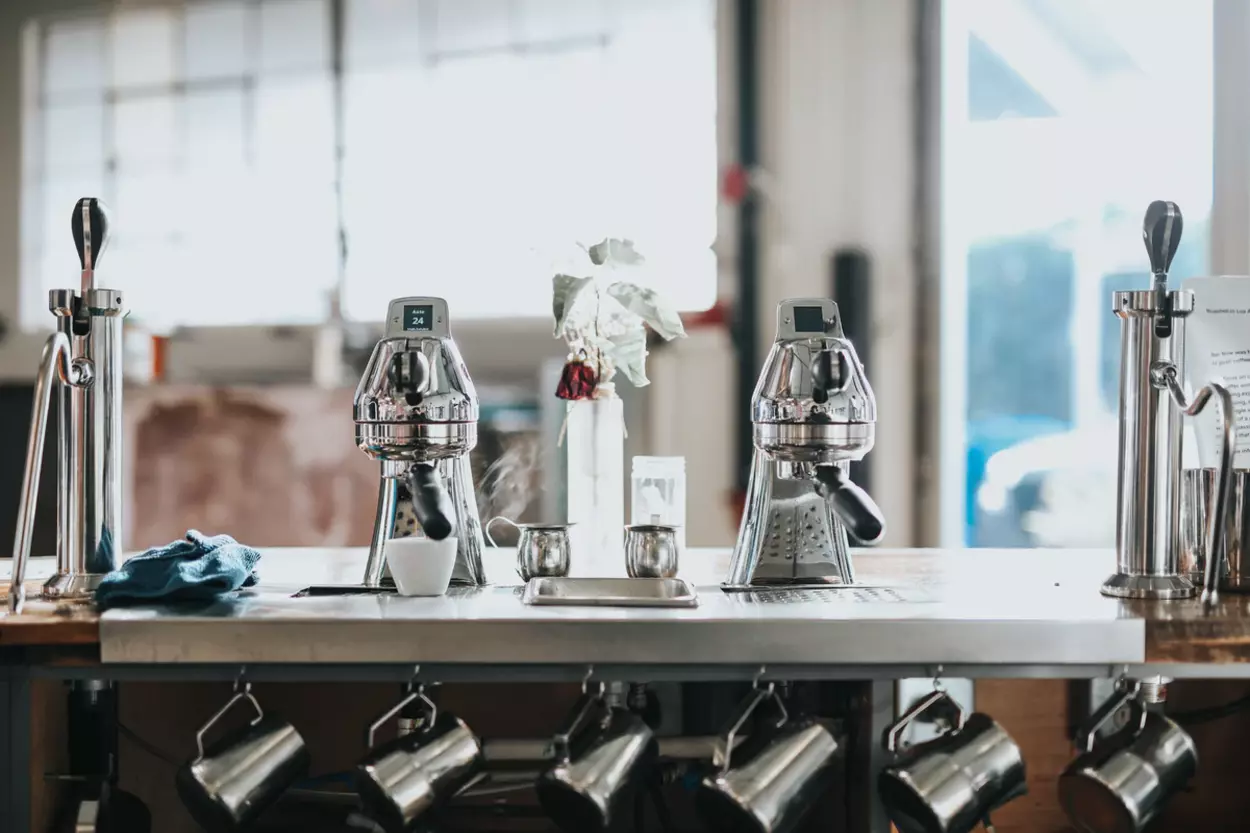 Different types of coffee robots placed on a counter