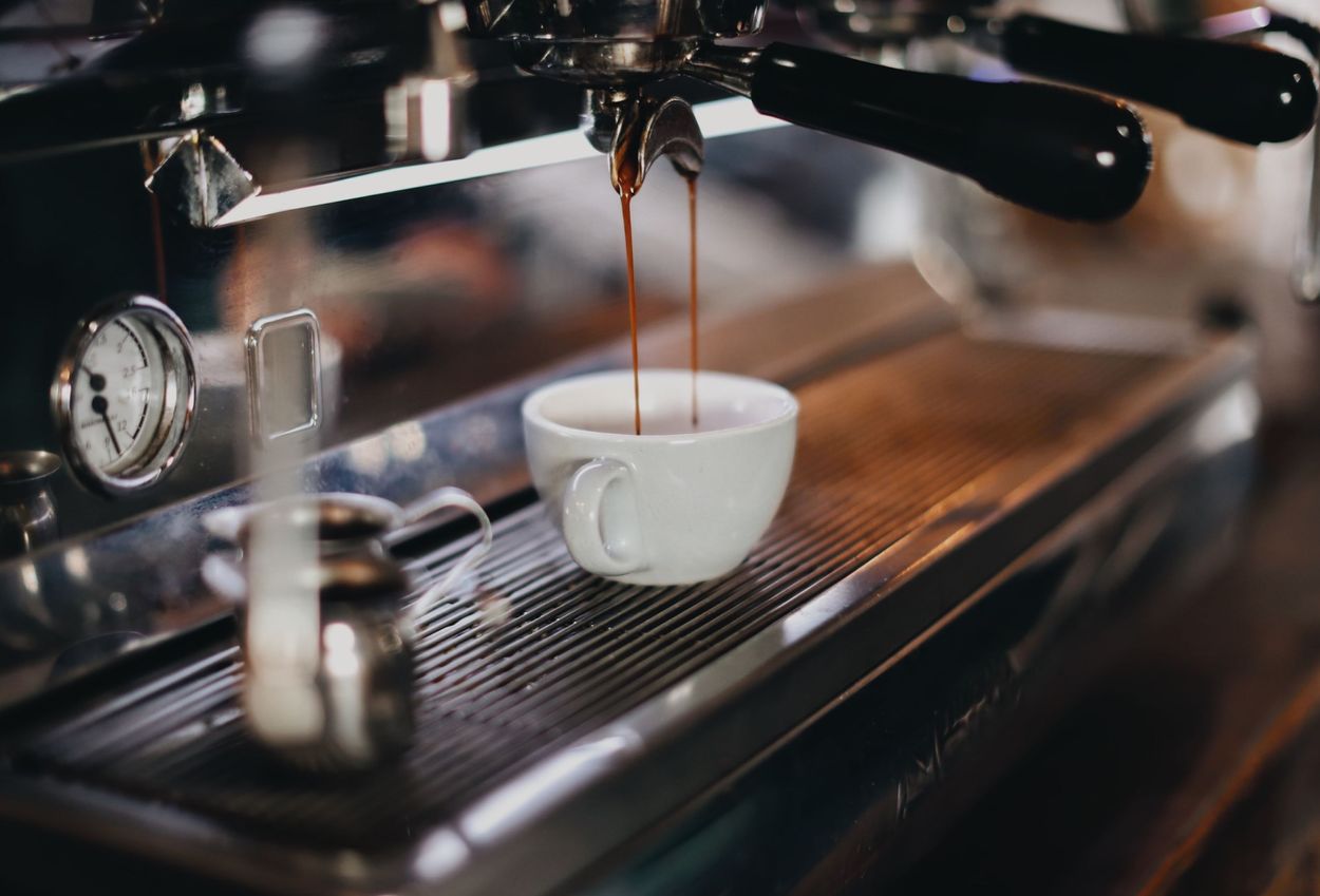 Image shows coffee being poured into a cup.